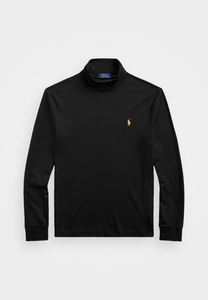 Svart langermet polo-skjorte laget av bomull, med høy krage, ribbede mansjetter, og en liten gullbrodert logo på venstre bryst.