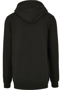 Sweat à capuche noir à manches longues avec capuche attachée, poignets et ourlet côtelés, montré de dos sur fond blanc uni.