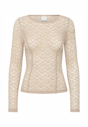 Beige lace long-sleeve top with a round neck. Features a floral pattern and fitted design, accentuating the body shape. Soft texture.