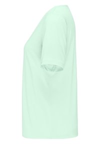 T-shirt vert menthe à manches courtes, en tissu doux, avec un col rond et une coupe décontractée, dotée d'un ourlet droit.