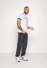 Sergio Tacchini CARSON - Calças de fato de treino - ebony/white