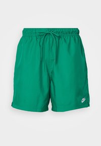 Zelené plavecké šortky Nike s elastickým pásem, stahovací šňůrkou a malým logem v pravém dolním rohu. Hladký, lehký materiál.