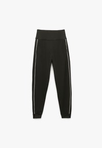 Sorte atletiske leggings med høj talje, med hvide sidelister og et tapered ben design. Fremstillet af et glat, strækbart stof.