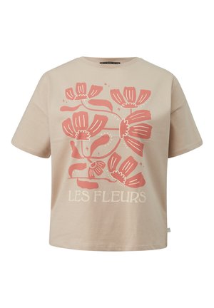 Beige Baumwoll-T-Shirt mit kurzen Ärmeln und lockerer Passform. Mit einem rosa Blumenmotiv und dem Text "LES FLEURS" darunter.