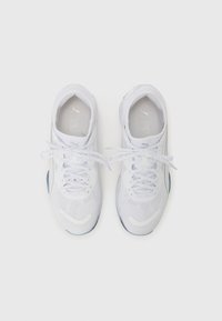White athletic shoes with a mesh upper, lace-up design, padded tongue, and subtle brand logo on the tongue. Rubber outsole provides traction.