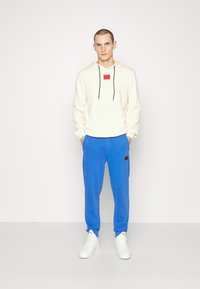 HUGO DARATSCHI - Sweatshirt com capuz - natural
