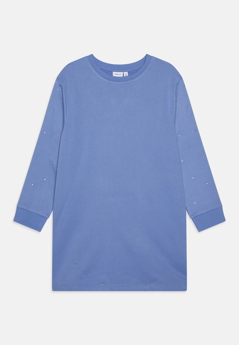 Μπλε μακρυμάνικη μπλούζα φτιαγμένη από μαλακό βαμβάκι, με στρογγυλή λαιμόκοψη και μικρές μεταλλικές λεπτομέρειες κατά μήκος των μανικιών. Απλή, χαλαρή γραμμή.