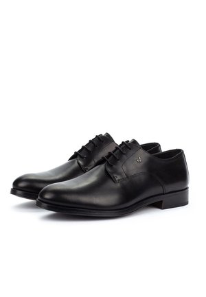 Pair of black leather formal lace-up shoes with low heels, smooth finish, and subtle stitching details on a white background.
