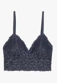 Bralette en dentelle bleu marine avec un motif floral, bretelles ajustables et un bord festonné le long de l'encolure et de la bande inférieure. Texture douce.