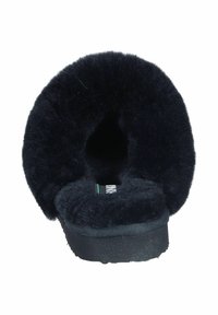 Black slipper with a round, fluffy faux fur lining and a flat sole, featuring a green and white accent tag on the inner side.