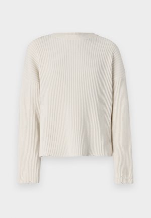 Maglione a costine color crema con maniche lunghe, scollatura rotonda e vestibilità slacciata. Presenta dettagli con orlo sfilacciato e tessuto strutturato.