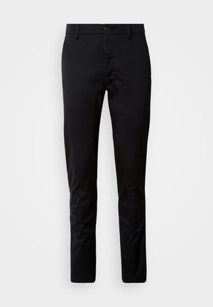 Pantalones negros de corte ajustado, fabricados con una tela suave. Presentan una cintura con cierre de botón y piernas rectas.
