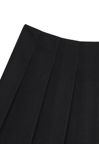 Black pleated skirt in a textured fabric, featuring three prominent vertical pleats and a structured waistband.