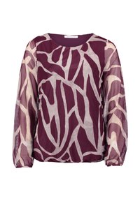 Przezroczysta bluzka z długim rękawem w abstrakcyjny wzór fioletowy i beżowy, okrągły dekolt oraz elastyczne mankiety.