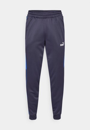 Navy sportieve broek met elastische tailleband, smalle benen en blauwe zijaccenten. Gemaakt van soepel, lichtgewicht materiaal. Puma-logo aan de voorkant.