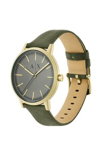 Reloj de tono dorado con un dial redondo gris, manecillas doradas y correa de tela verde. Presenta un diseño minimalista y un suave reverso de cuero.