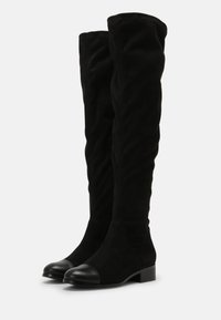 Black over-the-knee boots made of suede with a matte finish, featuring a rounded toe with a contrasting black leather cap and low block heel.