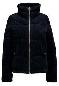 Svart kordflorsfodrad jacka med hög krage, dragkedja fram, långa ärmar och knappfickor.