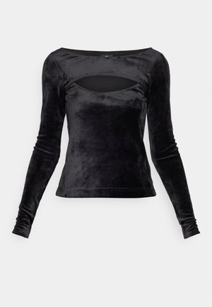 Black long-sleeve top made of soft velvet, featuring a scoop neck with a cut-out detail and a fitted silhouette. Smooth texture throughout.