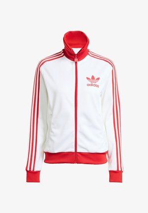 Weißer Trainingsjacke mit roten Akzenten, Vollreißverschluss, hohem Kragen, drei roten Streifen an den Ärmeln und gesticktem roten Adidas-Logo auf der Brust.