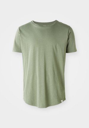 Short-sleeve T-shirt in light green, soft fabric, crew neck, straight hem, with a small label detail at the bottom left.