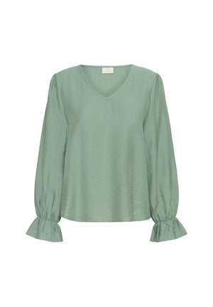 Blouse vert clair avec un décolleté en V, des manches longues bouffantes et des poignets froncés. Fabriquée dans un tissu doux et texturé avec une coupe décontractée.
