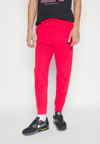 Jordan WARMUP PANT - Calças de fato de treino - fire red