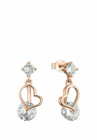 Roséguld hjärtformade örhängen med två klara runda ädelstenar, en med nagel och en hängande inom hjärtats kontur, på en vit bakgrund.