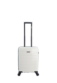 White hardshell suitcase with horizontal grooves, retractable black handle, four black wheels, and a front logo accent.