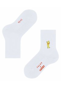Weiße Baumwollsocken mit einem gelben Bärenmotiv und rotem Text "FALKE x HARIBO". Geschmeidige Textur, Knöchelhöhe mit gerippten Bündchen.