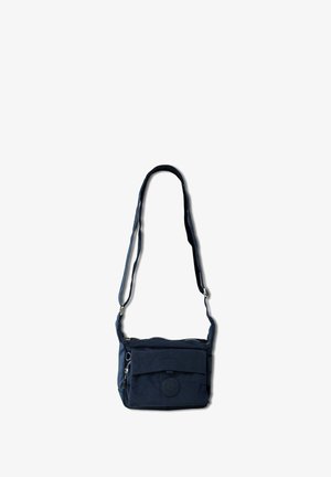 Navy blue crossbody bag made of soft fabric with a front pocket, zip closure, an embossed logo, and an adjustable strap.