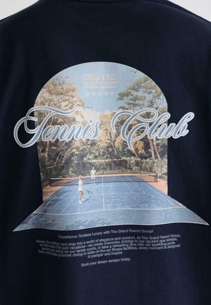 Navy T-shirt featuring a graphic print of a tennis court scene, with two players, surrounded by trees and the text "Tennis Club."