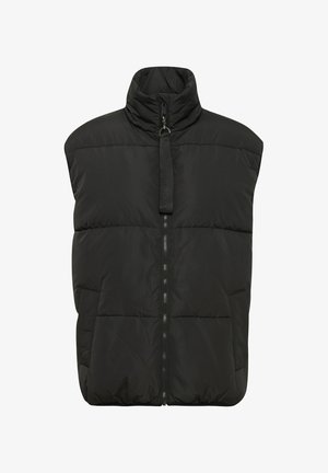 Musthave must vest, mille kõrge kaelus, ees lukk ja küljetaskud. Omab jämedat õmblust ja sujuvat tekstuuri. Ilma varrukateta.