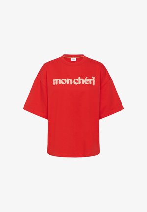 Piros, túlméretezett pamut póló, elején puha fehér "mon chéri" felirattal. Rövid ujjú, kerek nyakú.