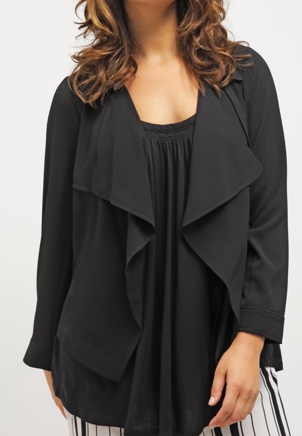 Black draped cardigan with a soft, textured fabric, featuring a casual open front and long sleeves, layered over a solid black top.