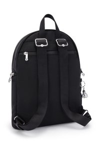 Black nylon backpack with a rounded shape, two adjustable shoulder straps, and metallic accents. Features a zippered compartment and a charm.