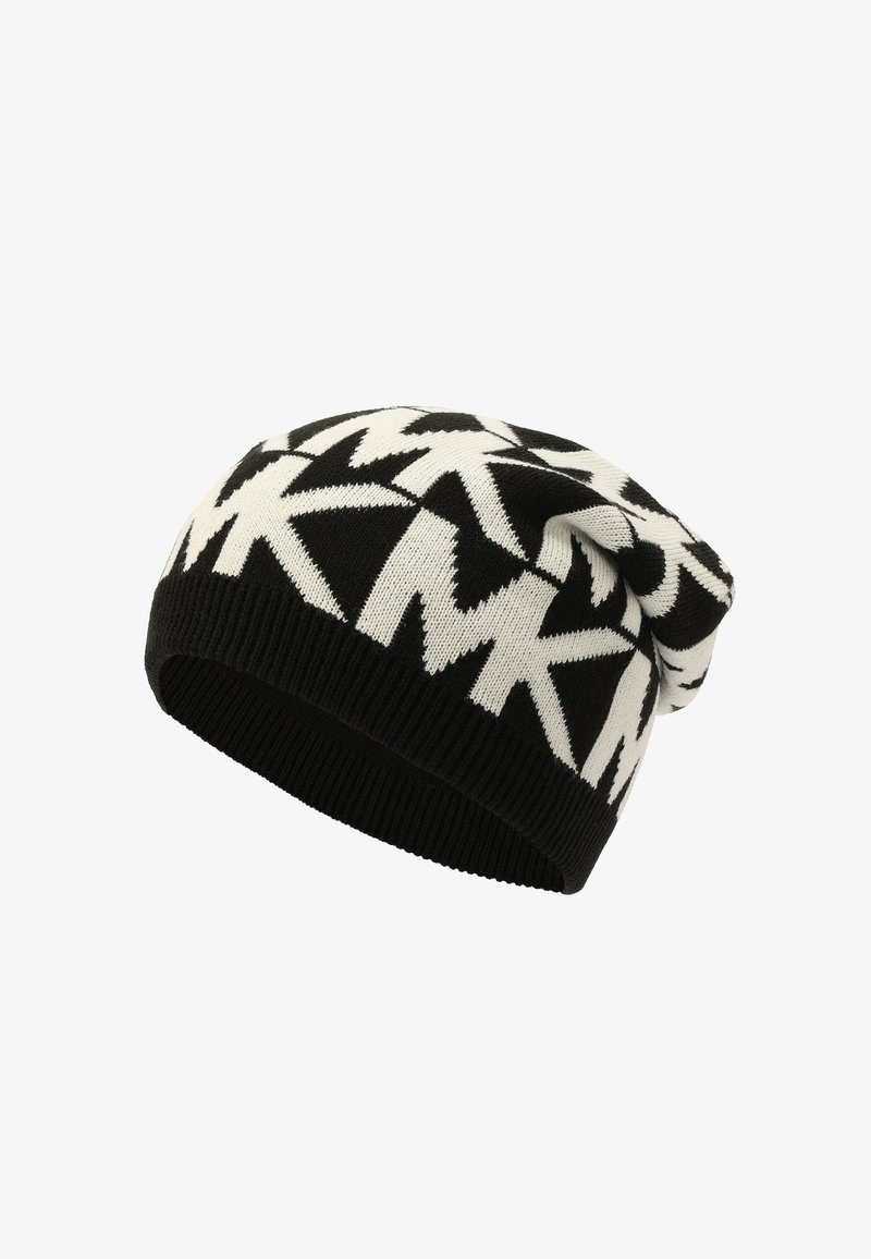 Black and white knitted beanie with bold zigzag pattern and ribbed edge, slouchy fit.