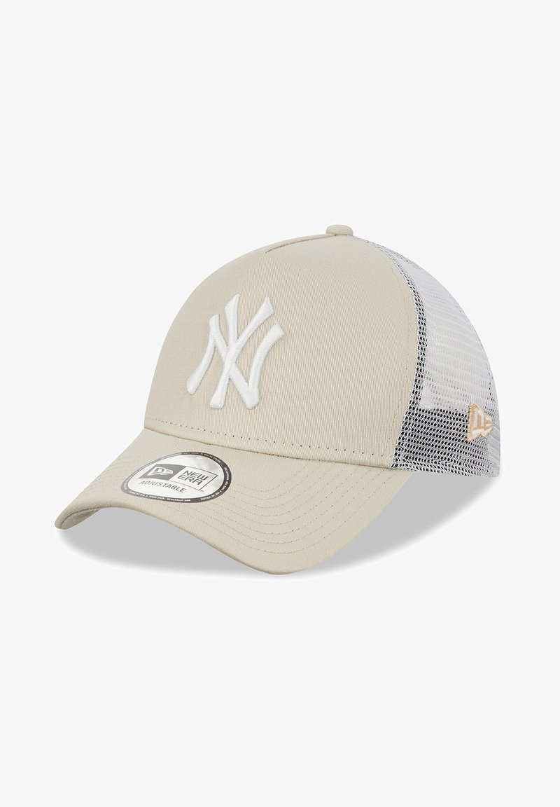 Beige cap with a curved brim, featuring a white embroidered NY logo. Mesh back, adjustable strap, and branded sticker on the visor.