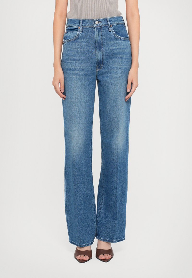 Light blue wide-leg jeans made of denim, featuring a high waist, traditional five-pocket design, and subtle fading on the thighs.
