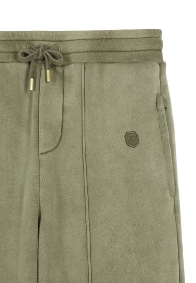 Khaki sweatpants met verstelbare trekkoord taille, gouden aglets en zijzakken. Bevat een klein geborduurd logo op de voorkant.