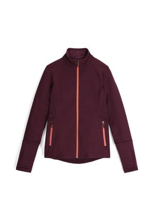Aansluitende bordeauxrode jas met hoge kraag, ribbelstructuur, twee ritszakken en contrasterende oranje rits. Glad, duurzaam materiaal.