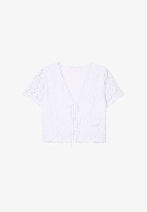 Maglietta bianca cropped con motivo in pizzo, maniche corte, scollatura a V profonda e dettaglio con laccetto nella parte frontale, caratterizzata da bordi scallop.