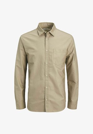 Beige gombos ing hosszú ujjakkal, pamutból készült, egyetlen mellzsebbel és klasszikus gallérdizájnnal.