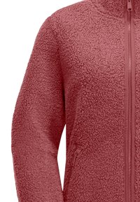 Fleece jacket in a dusty rose color, featuring a full zipper, high collar, and textured, fluffy fabric with side pockets.