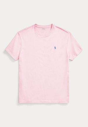 T-shirt rosa chiaro a maniche corte con scollo rotondo e piccolo logo ricamato blu raffigurante un giocatore di polo sul petto sinistro.