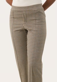 Ruitbroek in beige en marineblauw, met een aansluitend ontwerp, een vlakke voorkant en subtiele textuur. Gestructureerde stof met een gladde afwerking.