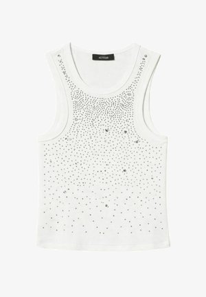 Canotta bianca senza maniche con scollo rotondo, decorata con piccoli borchie e paillettes argentate sparse sulla parte anteriore.
