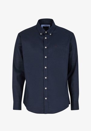 Tumed sinine nööbiga särk pikkade varrukatega, krae, valged nööbid ja rinnatasku, millel on peened õmblused. Puuvilla segu kangas.