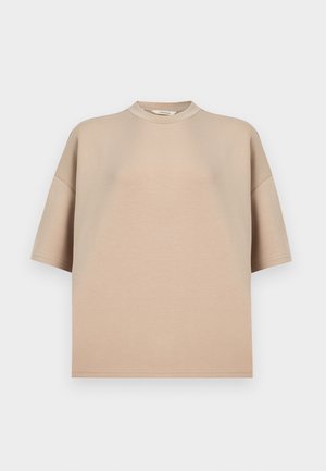 Camicia beige a maniche corte con scollo rotondo, realizzata in tessuto morbido. Presenta una vestibilità comoda e un design semplice senza decorazioni.