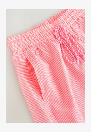 Pink striped shorts with an elastic waistband and adjustable drawstring. Fabric is lightweight with a smooth texture. Side pockets visible.